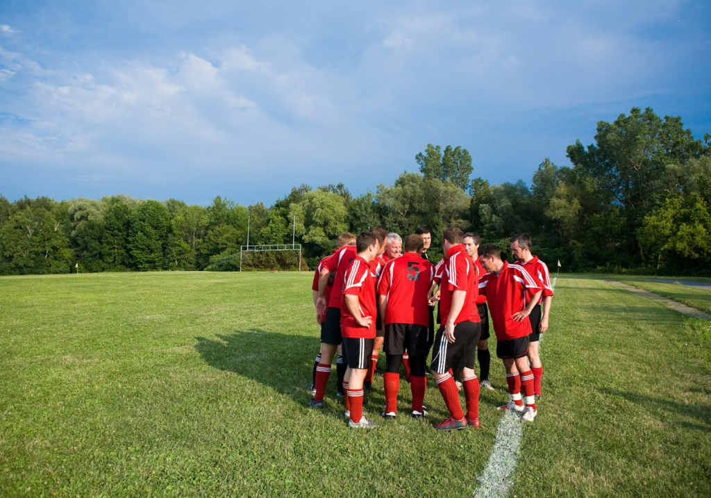 Photo by Getty Images A group of men on a field wearing sports wear.