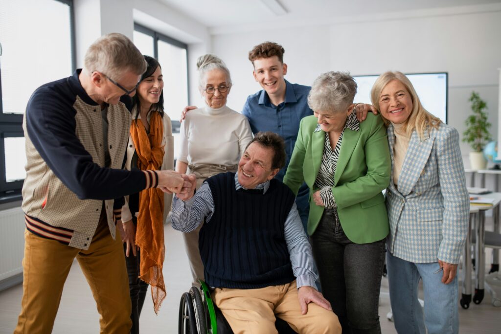community group of mixed aged adults looking happy